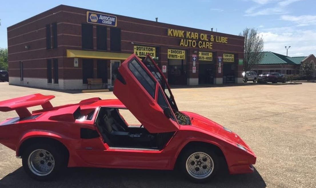 car Infront of kwik kar 